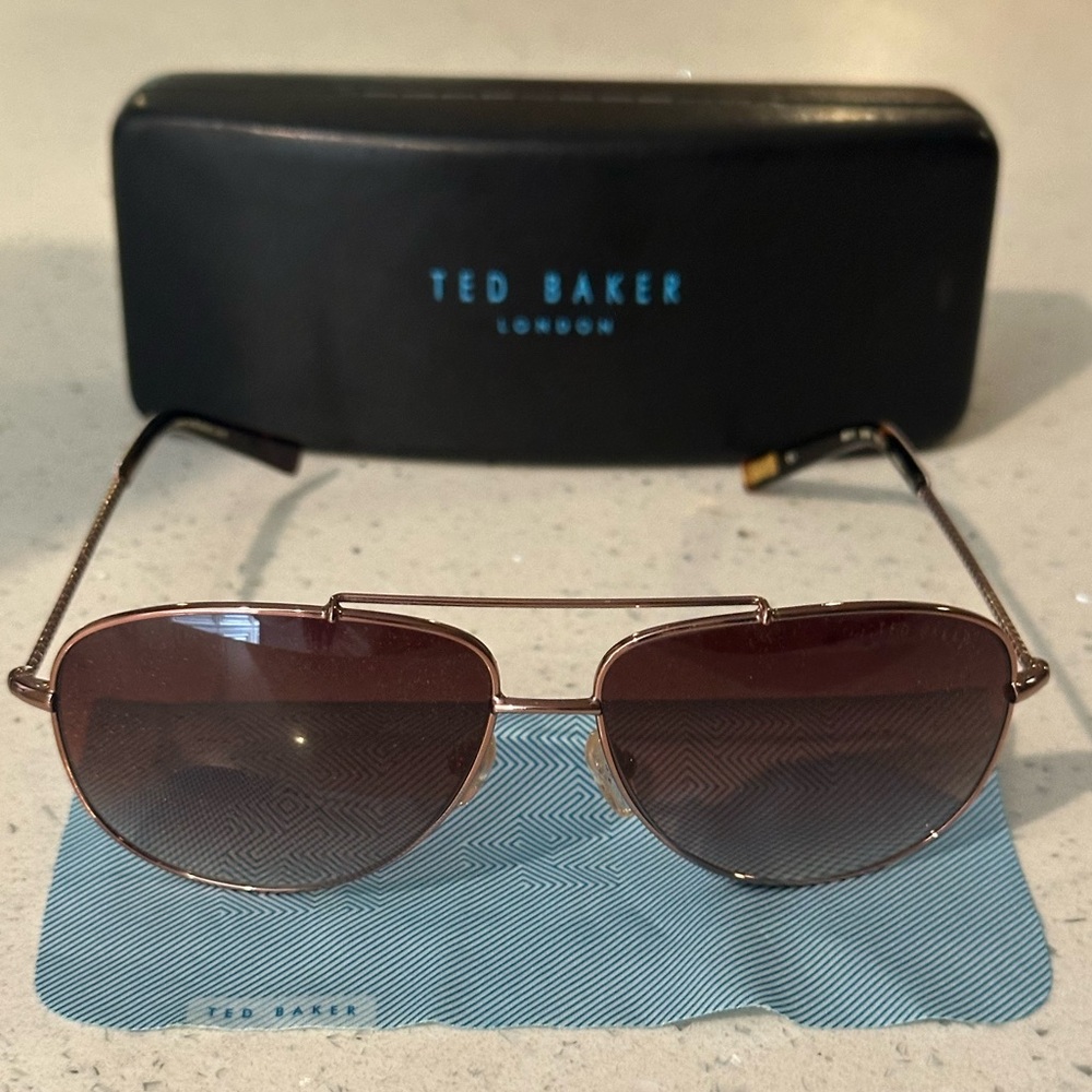 Ted Baker Dark Brown Sunglasses with floral detail sides.